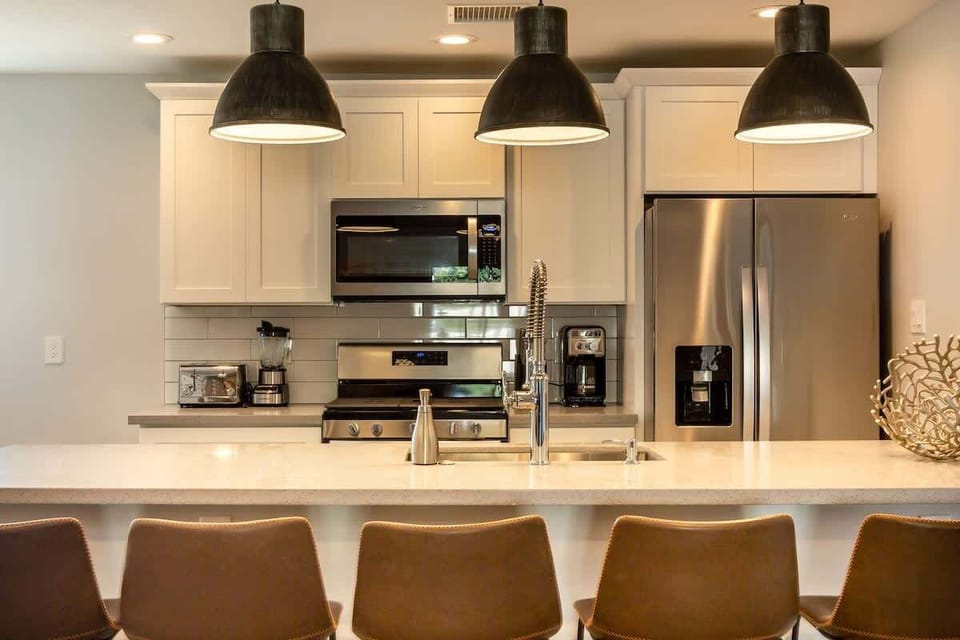Cook in style with a fully equipped kitchen featuring sleek stainless steel appliances and ample space for meal prep.