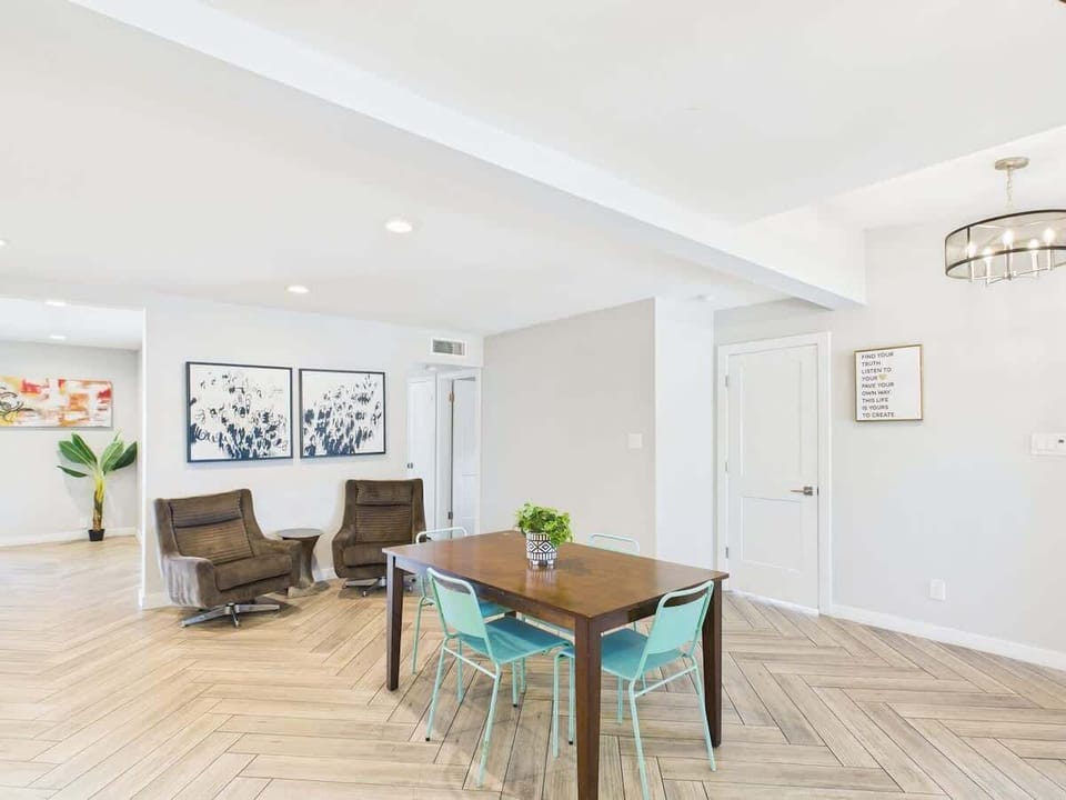 Gather around the dining table for meals and memories in this inviting space.
