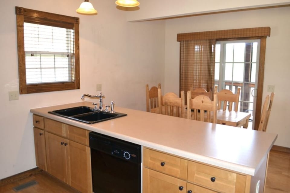 a 6-seater dining table towards the screened porch