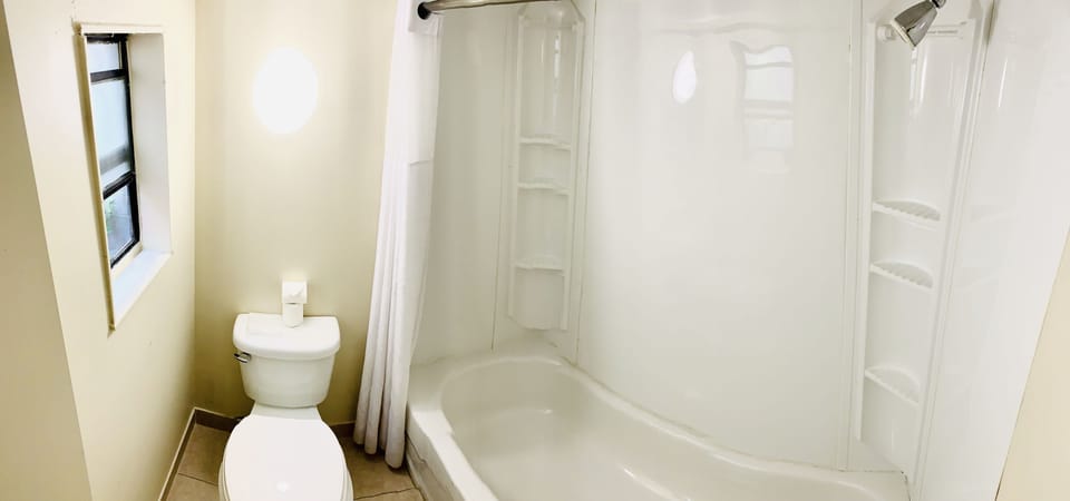 Double Room, 2 Double Beds, Microwave, Ground Floor | Bathroom | Combined shower/tub, free toiletries, hair dryer, bidet