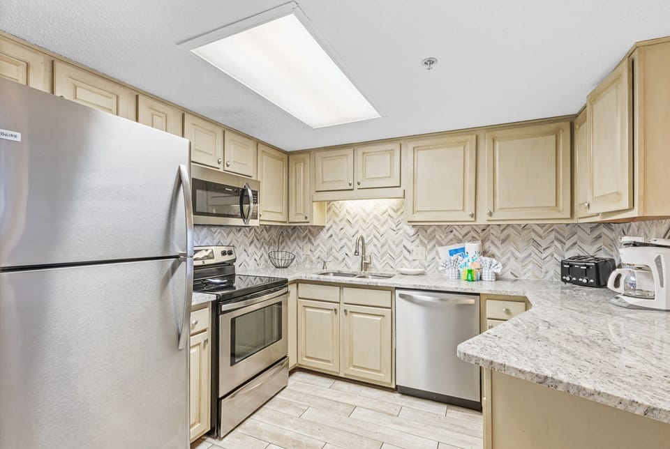 Signature Condo, 2 Bedrooms, Balcony | Private kitchen | Coffee/tea maker, full-size fridge, microwave, oven