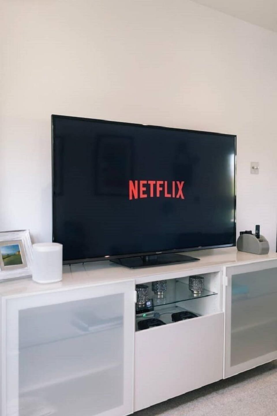 Family lounge (55” Panasonic 4K TV with Apple gaming controllers)