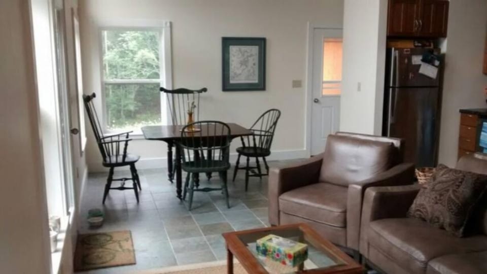 open space for dining, kitchen, and living room with view of the bay