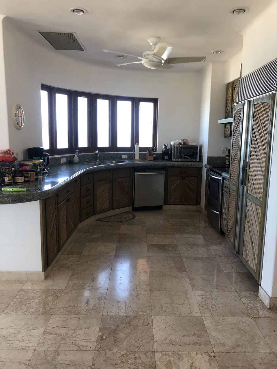 master kitchen, subzero refrig/freezer, electric cooktop/oven, marble and view!