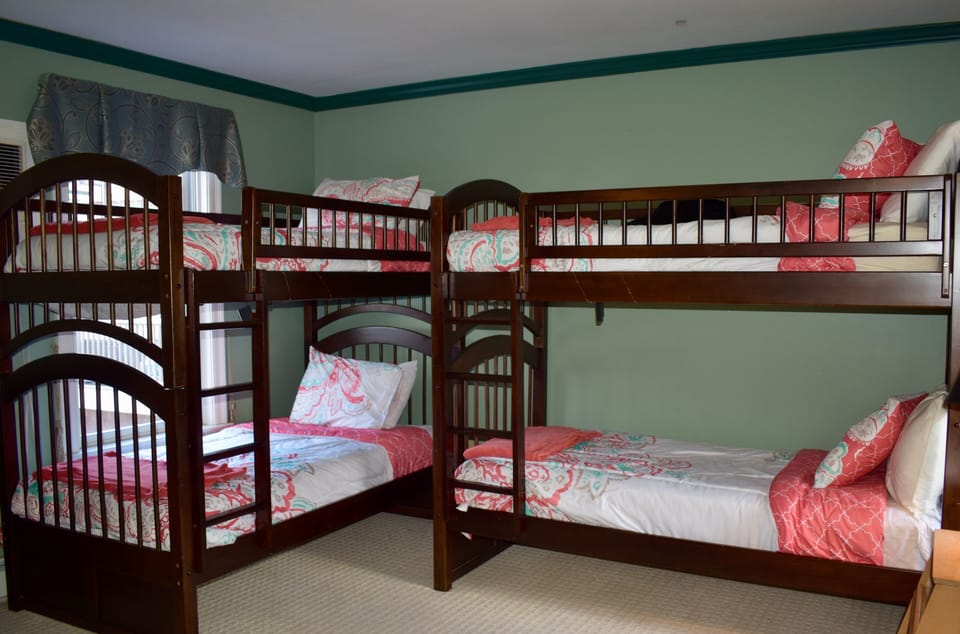 Bedroom 2 on 2nd floor with 4 bunks & full bathroom.