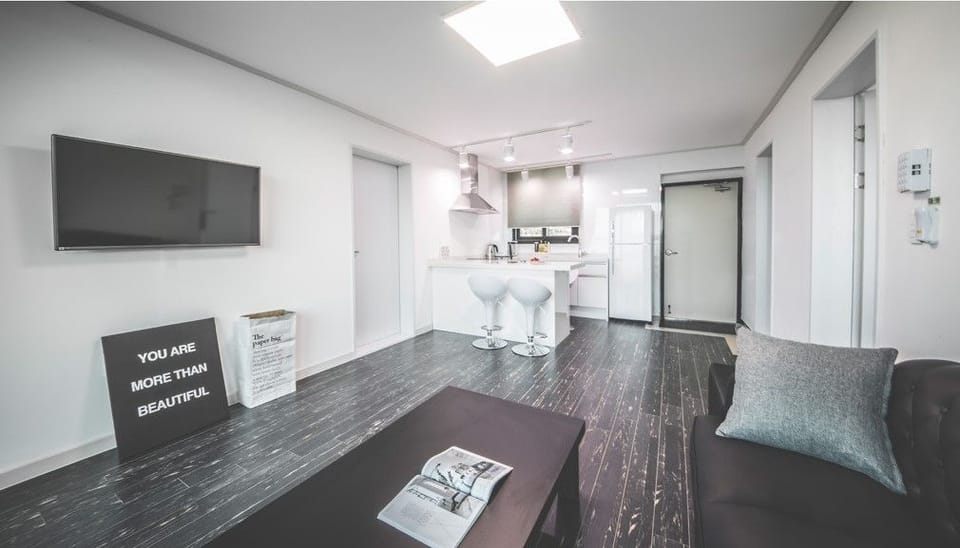 Suite, 2 Bedrooms | Living area | Flat-screen TV, heated floors