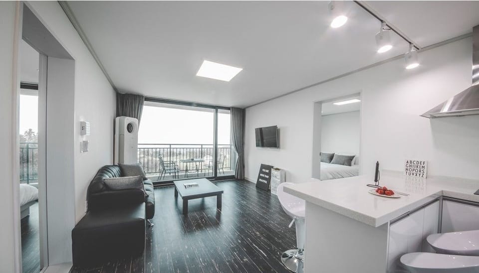 Suite, 2 Bedrooms | Living area | Flat-screen TV, heated floors