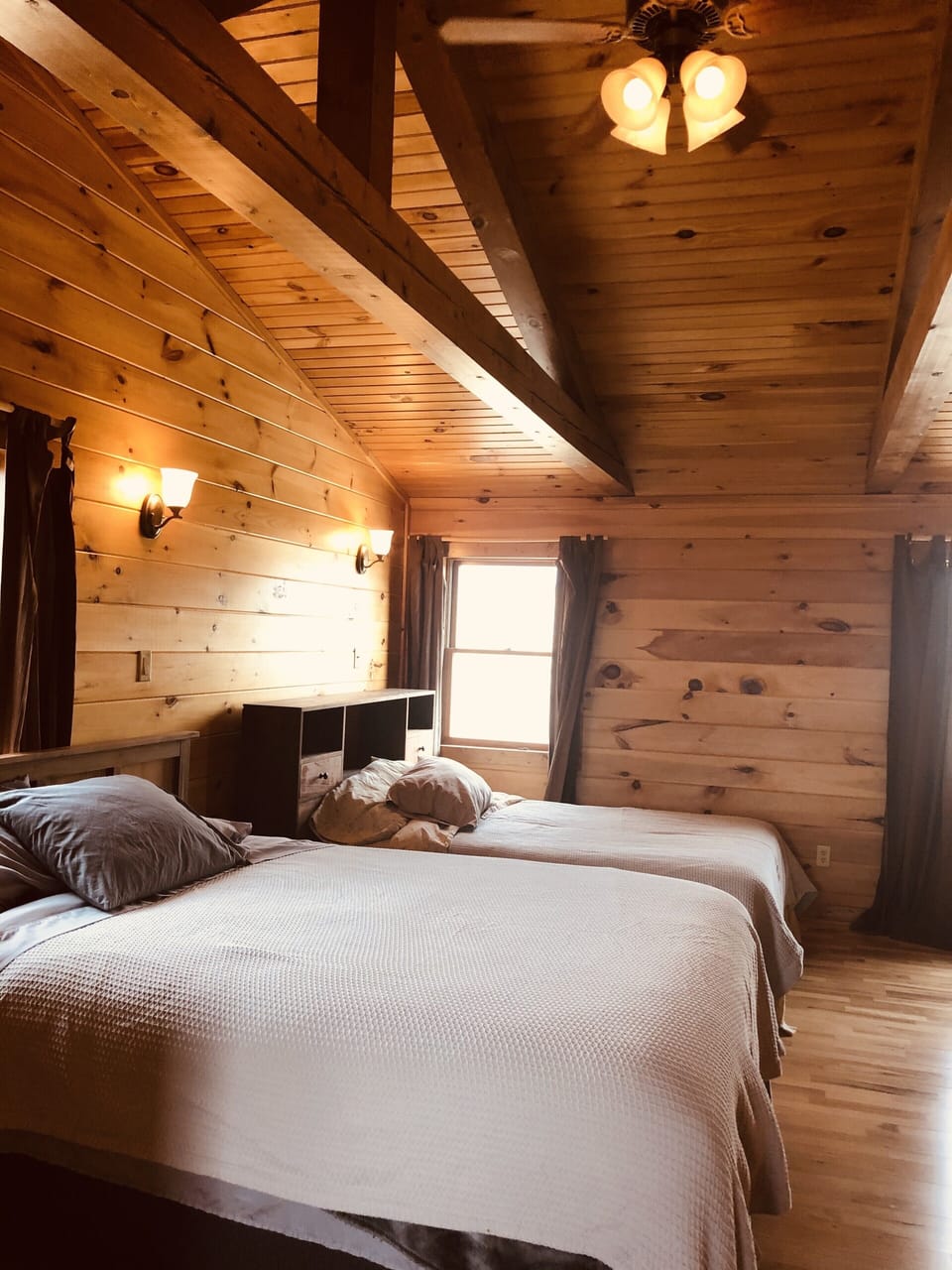 Large upstairs bedroom with a queen and double bed. 