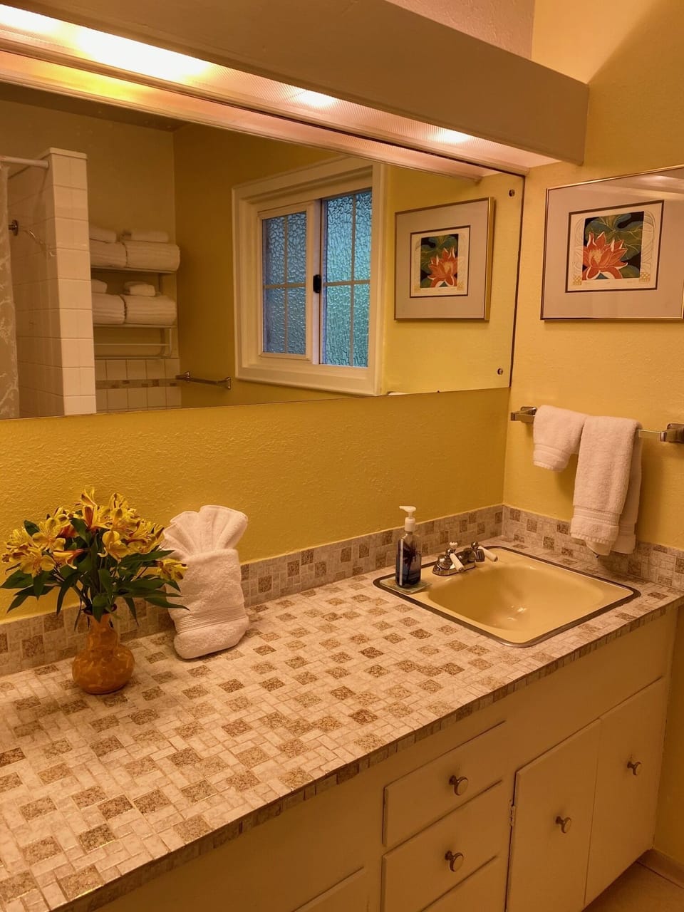 guest bathroom has tub/shower w/hand grip and taller comfort height toilet. 
