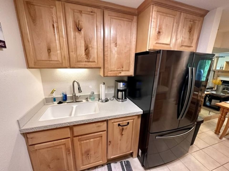 There's a coffee maker, dishwasher, toaster, iron, hair dryer, fire extinguisher, smoke detectors, carbon monoxide detectors.