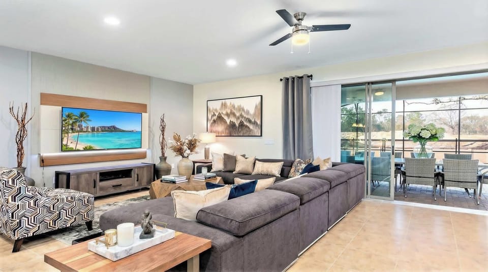 Stylish living area with sectional sofa, smart TV & patio access!