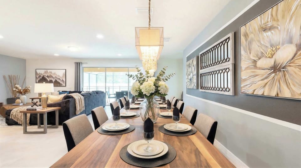 Elegant dining area with seating for 10, chic decor & warm lighting!