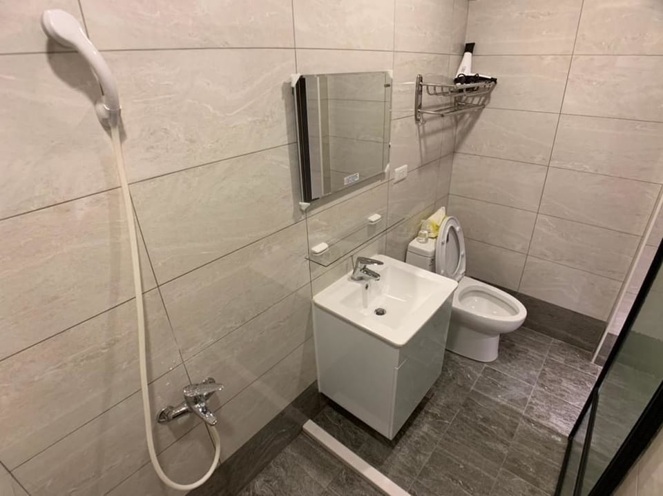 Shower, free toiletries, hair dryer, slippers