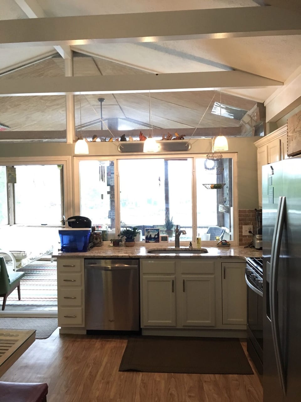 Kitchen overlooking screened in porch and right on the lake front. 