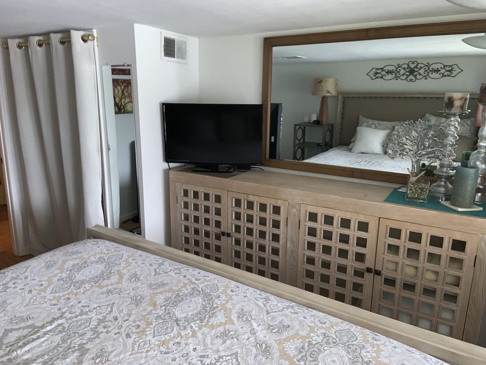 Downstairs bedroom with king size bed and view of lake.  