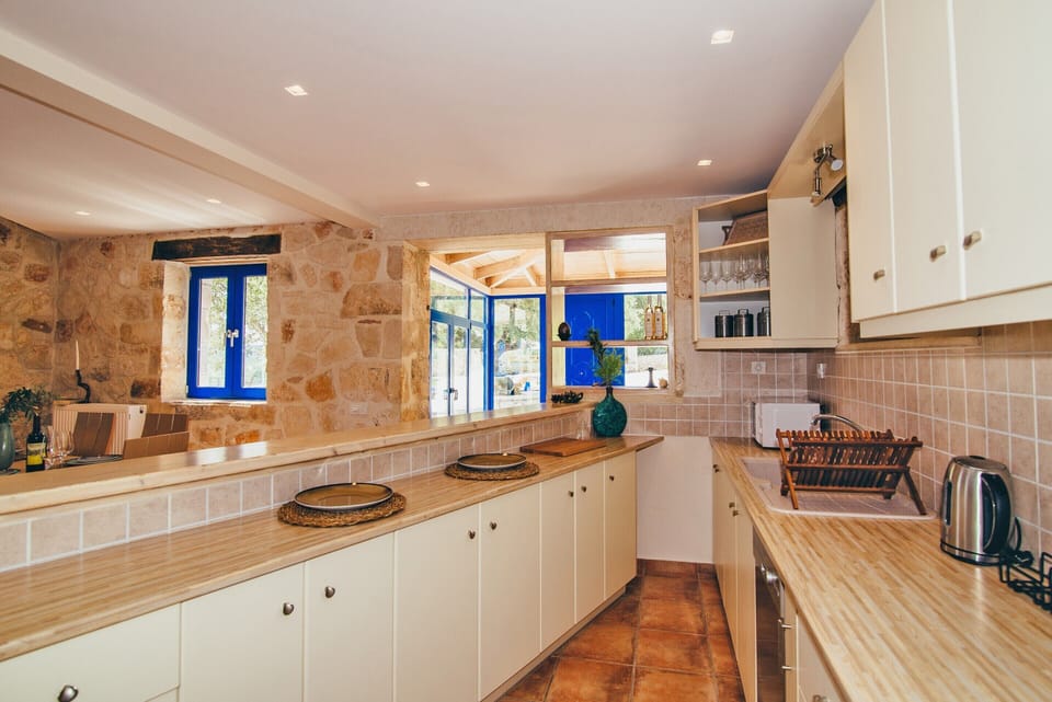 Villa | Private kitchen | Fridge, microwave, oven, stovetop
