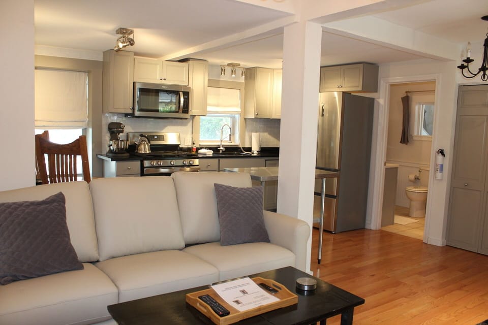 Large open living, dining, and kitchen areas