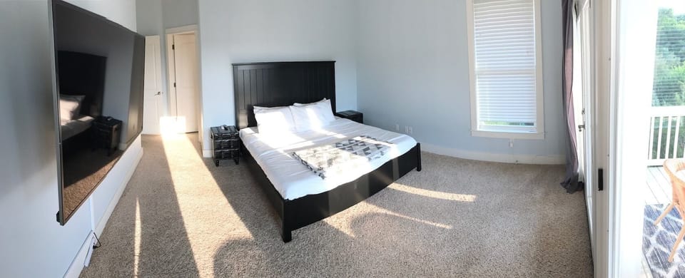 Master bedroom with king sized bed.
