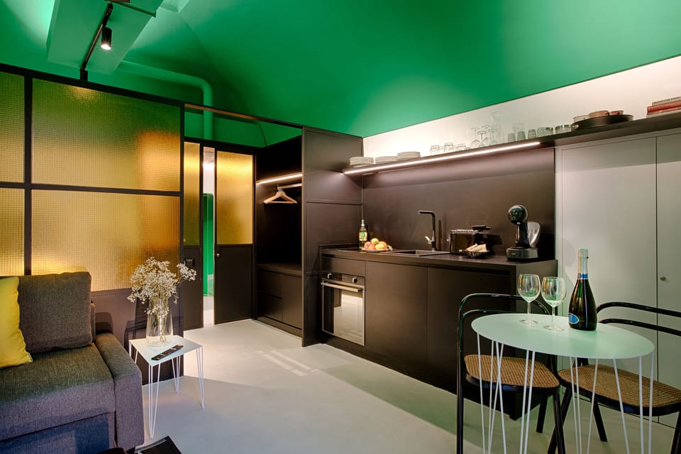 Deluxe Studio | Living area | Flat-screen TV