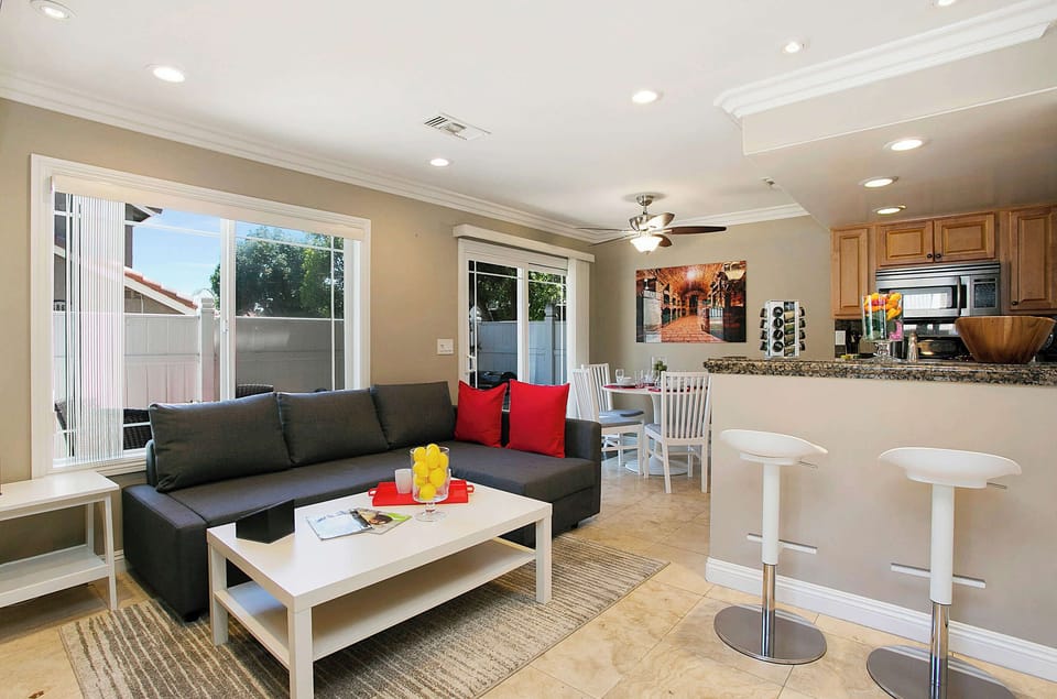A spectacular view of the living room, dining, and kitchen.