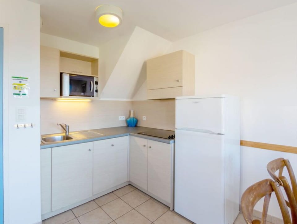 Prepare a meal in the equipped kitchen.