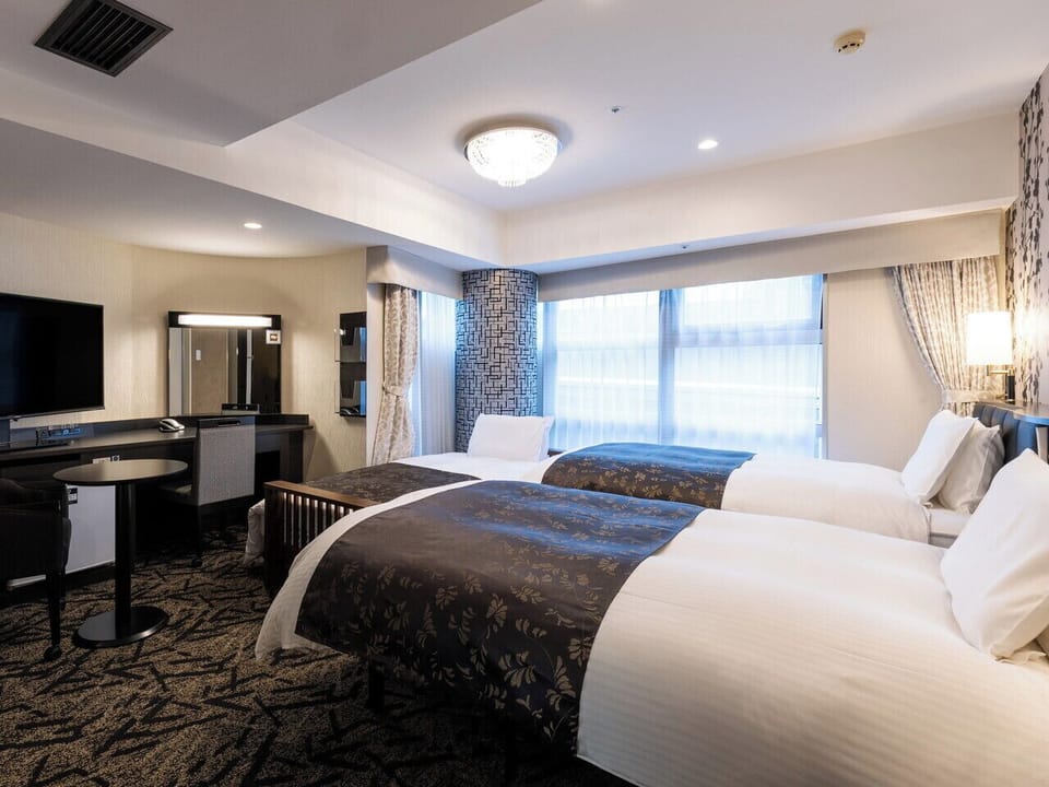 Triple Room, Non Smoking, Corner | Down comforters, desk, blackout drapes, free WiFi