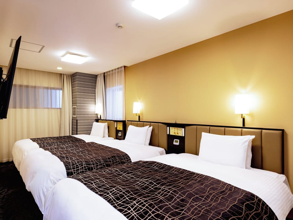 Triple Room, Non Smoking | Down comforters, desk, blackout drapes, free WiFi
