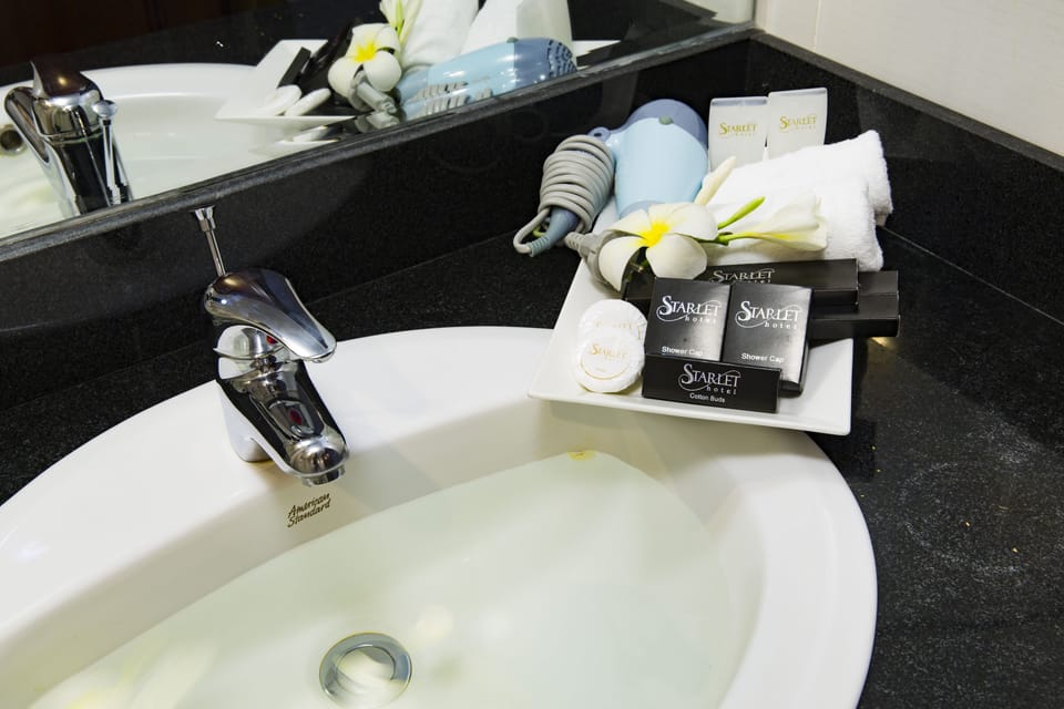 Senior Room, Balcony, City View | Bathroom amenities | Free toiletries, hair dryer, slippers, towels