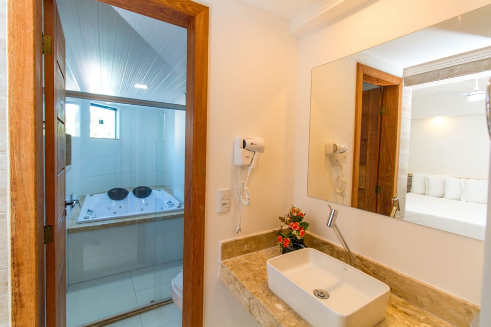 Deluxe Room | Minibar, desk, laptop workspace, blackout drapes