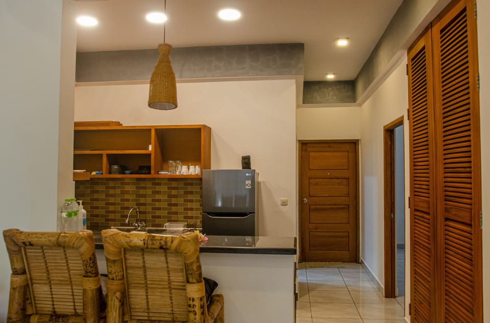 Deluxe Apartment, 2 Bedrooms, Kitchen, Pool View | Private kitchen | Full-size fridge, stovetop, electric kettle, cookware/dishes/utensils