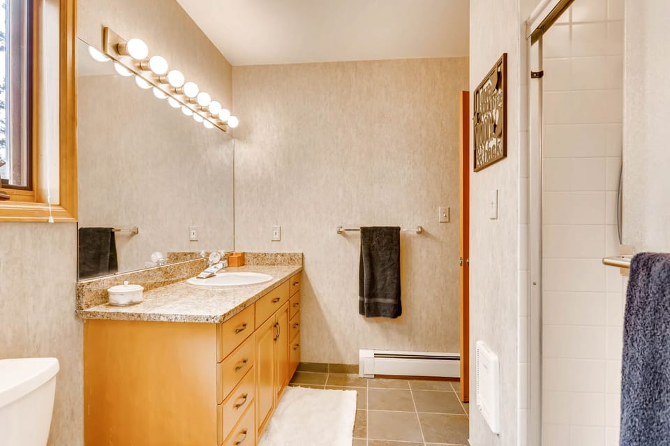 The bath downstairs has a walk in shower and granite counter tops.