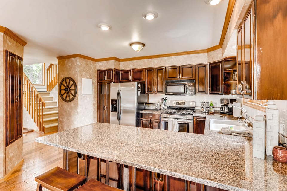 This kitchen has everything you will need for your stay. It is fully stocked with pots and pans, dishes, cookware, and cutlery.