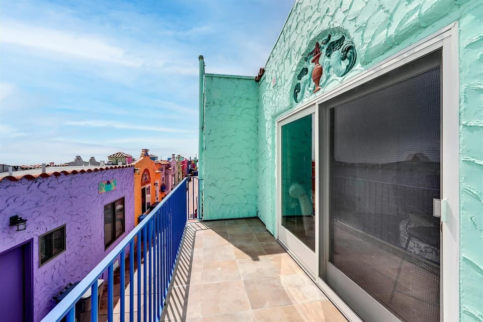 upstairs balcony with views of beach, ocean and pier