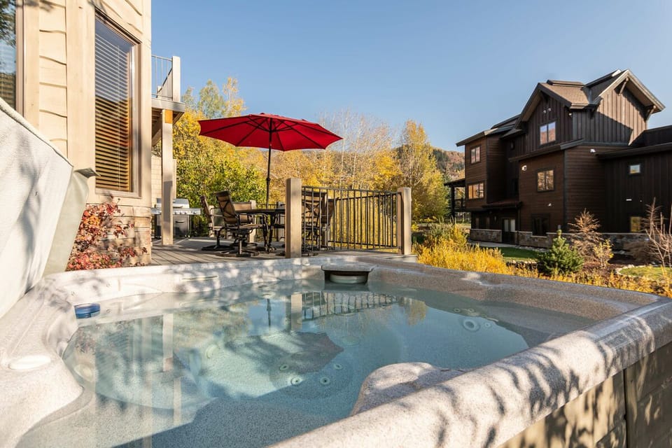 Enjoy the hot tub while people hang on the deck