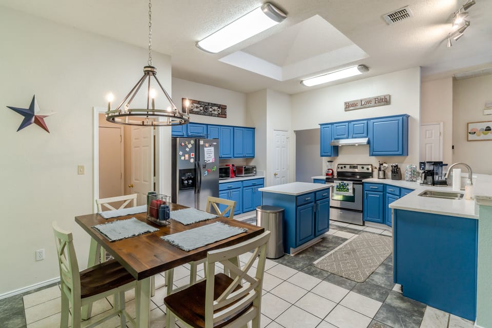 Large kitchen, equipped with the essentials to make long-term stays easy.  