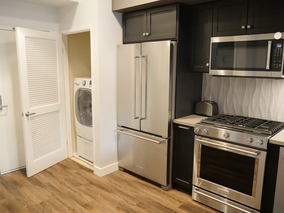 Combination Washer/Dryer unit in closet adjacent to kitchen