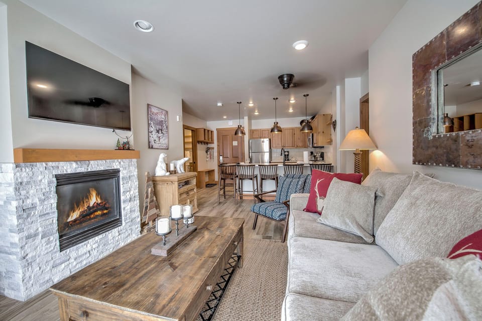 Sink into plush sofas by your crackling fireplace while the open kitchen beckons for cozy meal prep and conversation.