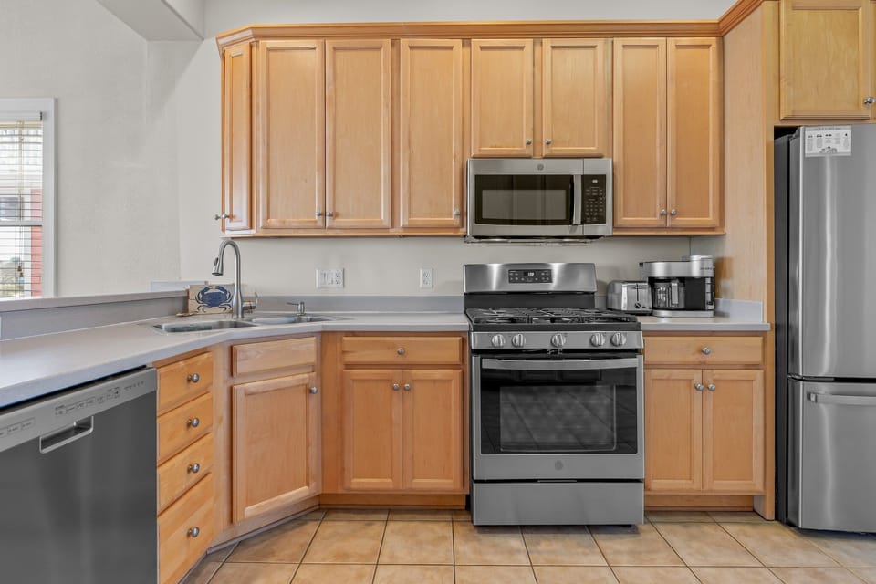 Gas range for your cooking needs in a fully stocked kitchen