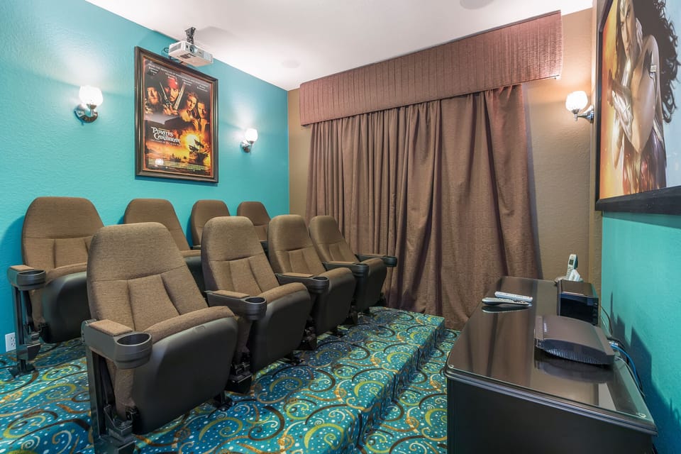 In home movie theater with ceiling surround sound and sub woofer