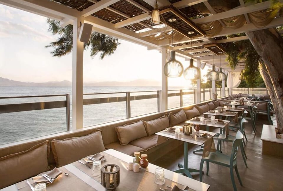 Breakfast, lunch, dinner served; Mediterranean cuisine, beach views 