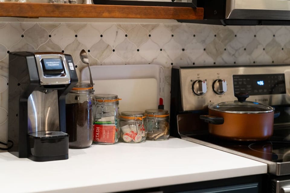 Fully stocked kitchen—coffee, tea, snacks, and everything you need to cook or chill.
