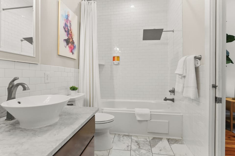 Master bathroom with rainfall shower and Jacuzzi tub and double sink vanities