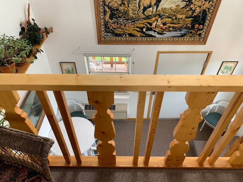 Looking down from upstairs king bed loft 