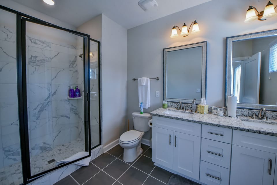 First Bathroom - The first bathroom has a double sink vanity and walk-in shower.