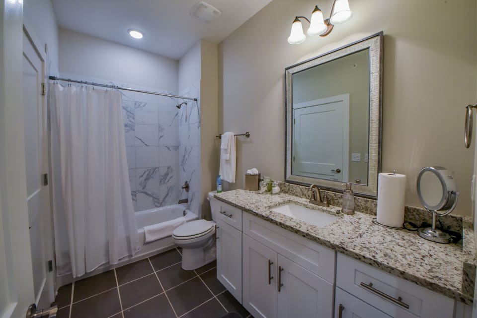 Second Bathroom - The second bathroom has a tub-shower.