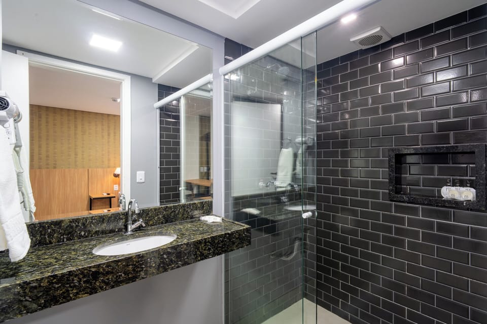 Standard Triple Room | Minibar, in-room safe, desk, blackout drapes
