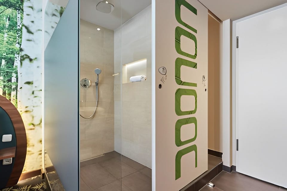 Shower, rainfall showerhead, hair dryer, towels