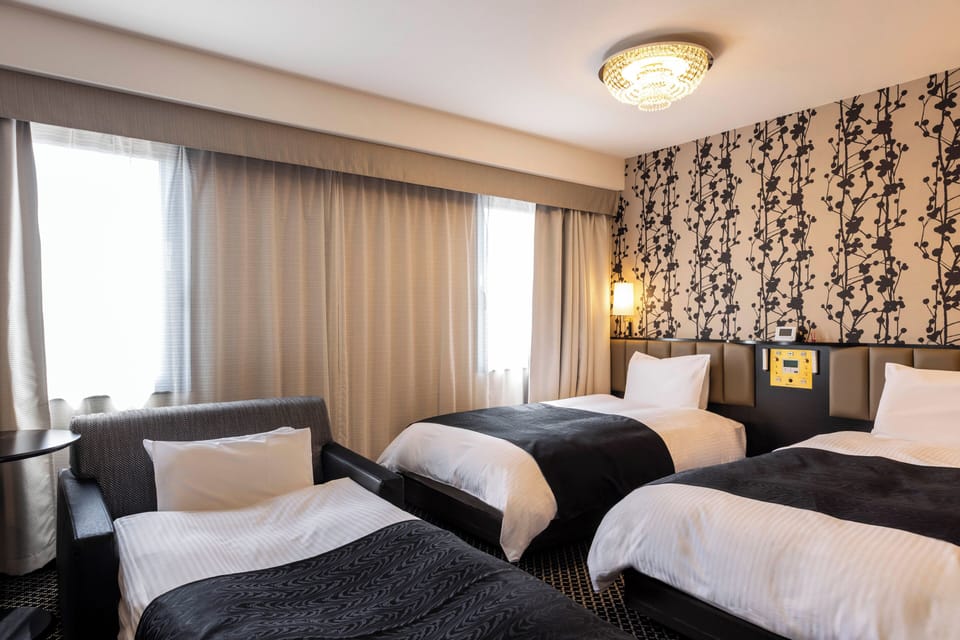Triple Room, Non Smoking | Down comforters, desk, laptop workspace, blackout drapes