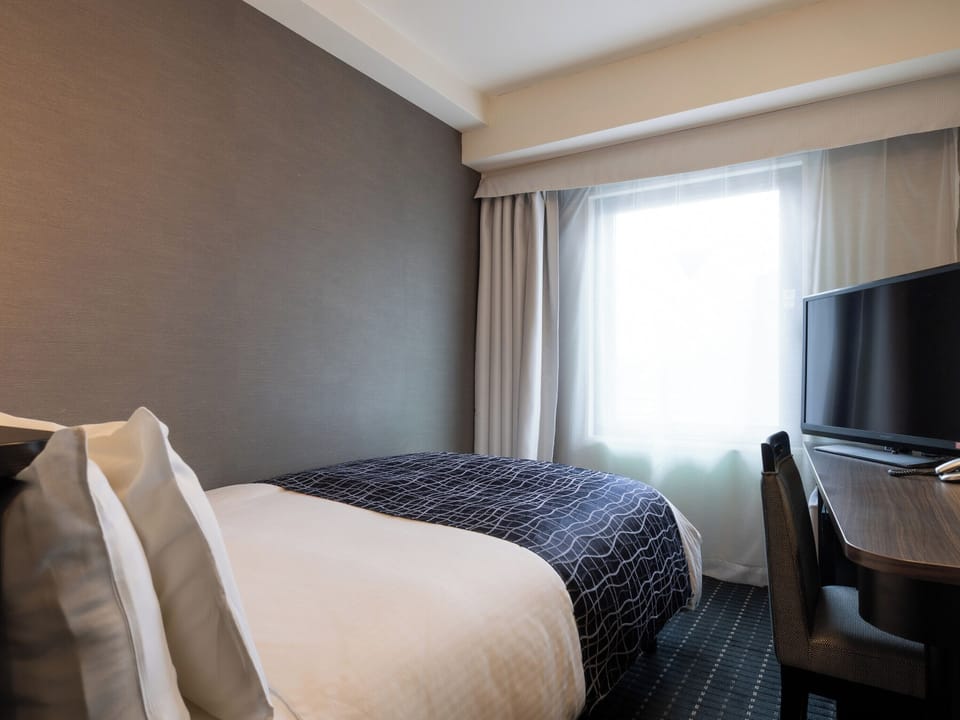 Desk, blackout drapes, WiFi (free), bed sheets