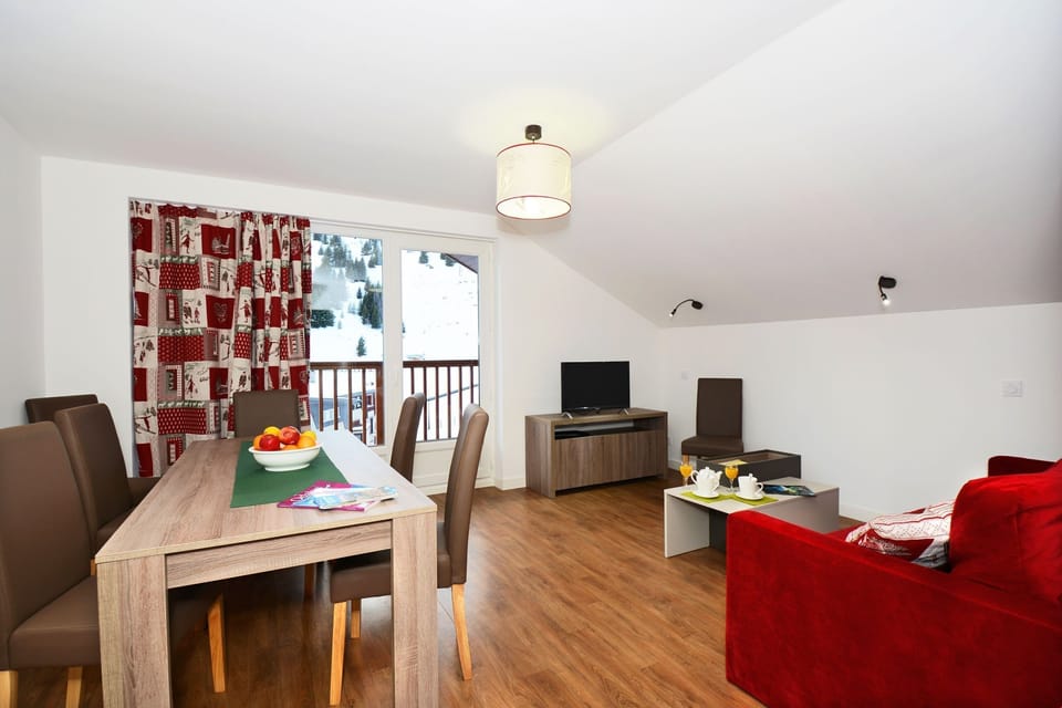 The lovely open-concept living area provides a relaxing atmosphere for your stay.